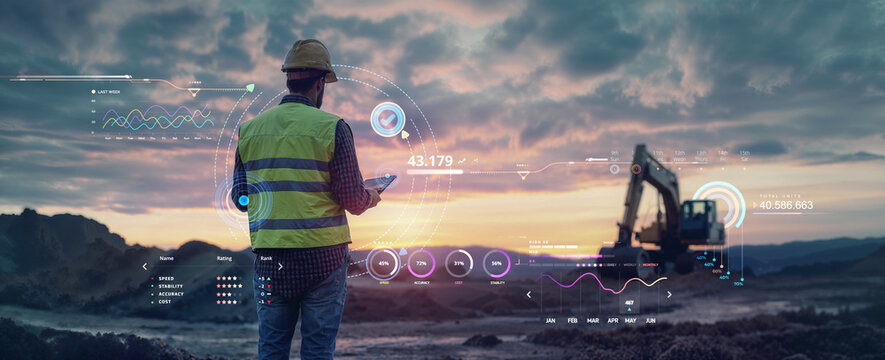 civil engineer or working holding tablet at a construction site with heavy building machine excavator working at sunset for contractor and real estate project development services - Powered by Adobe