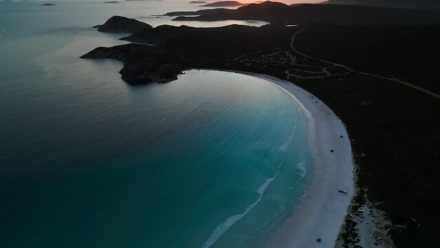 aerial view revealing lucky bay and the campground in Cape Legrand National Park at sunset, western australia