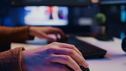 Focus on computer peripherals used by programmer to write lines of code on PC screen. Close up shot of keyboard and mouse used by developer working on fixing database errors, camera B - Powered by Adobe