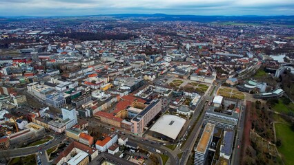 Fototapeta na wymiar Aerial around the downtown of the city Kassel in Hessen, Germany on a cloudy day in early spring 