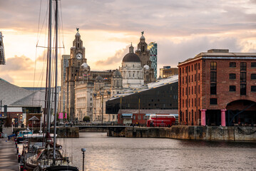 Liverpool waterfront skyline as seen from Albert Dock at sunset in summer