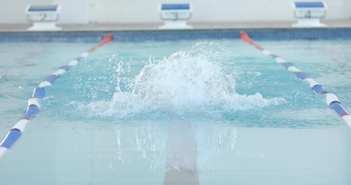 Swimmer in action at a pool during training