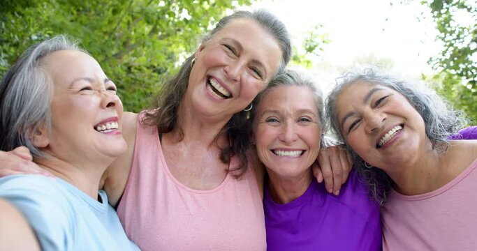 Senior biracial woman and Caucasian women share a joyful moment outdoors