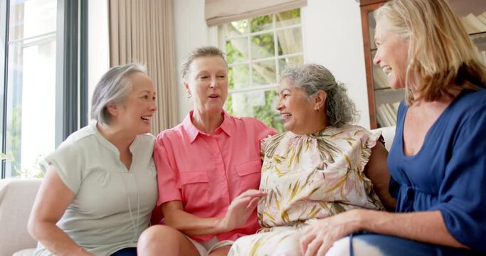 Senior diverse group of women share a moment of joy indoors