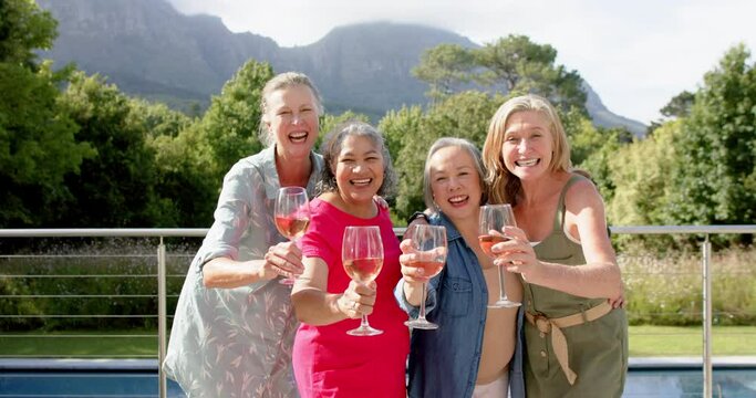 Diverse group of women toast outdoors