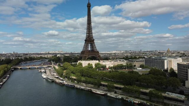 Tour Eiffel and Pont d'Iéna bridge on Seine River, Paris cityscape, France. Aerial drone view and copy space
