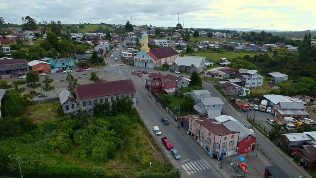 Flyover establishing the centenary street and the patrimonial church of Chonchi in Chiloe, Chile
