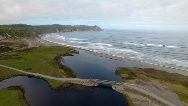 Panoramic drone shot of the coastline of Cucao, partly sunny Chilo&eacute;, Chile