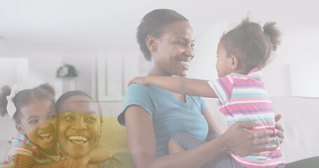 Composite of happy african american mother and daughter, embracing and hugging at home