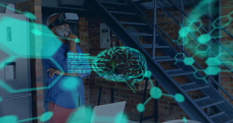 Image of scientific data in green floating in the foreground with a middle aged mixed race man weari