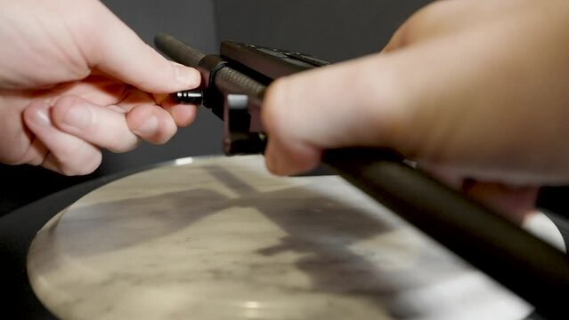 Thumbscrews in close up on the device.