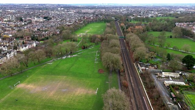 Above a nearly empty Wandsworth Common early in the morning in London UK