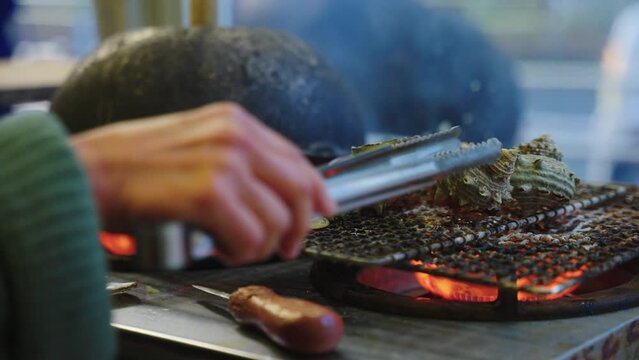 Oysters and Turban Shells Grilling in Japanese Street Food, Toba Japan