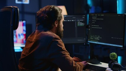 Computer scientist developing code on PC while in apartment office using java programming languages. IT admin brainstorming ways of fixing database errors while working from home, camera A