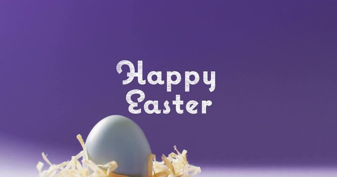 Animation of happy easter text over blue easter eggs on purple background