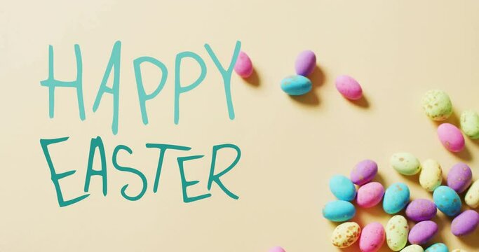 Animation of happy easter text over colourful easter eggs on yellow background