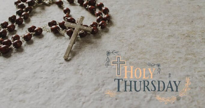 Animation of holy thursday text over christian rosary on grey background