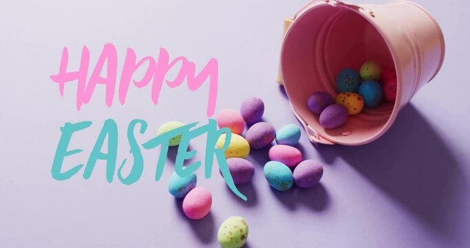 Animation of happy easter text over colourful easter eggs on purple background