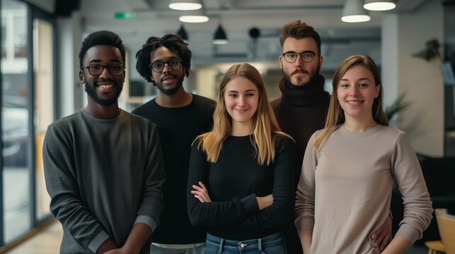 Diverse group picture of young freelancers man and woman standing looking at the camera