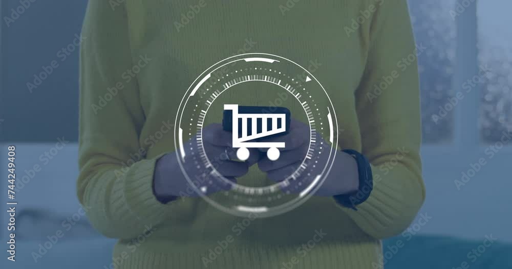 Poster animation of data processing and shopping trolley symbol over caucasian woman using smartphone