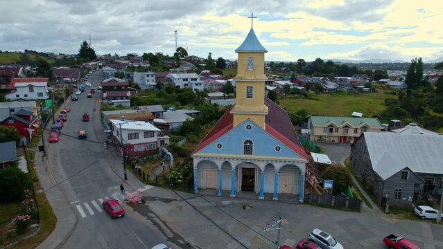 Dolly in flyover of the UNESCO World Heritage Church of Chonchi in Chilo&eacute;, Chile