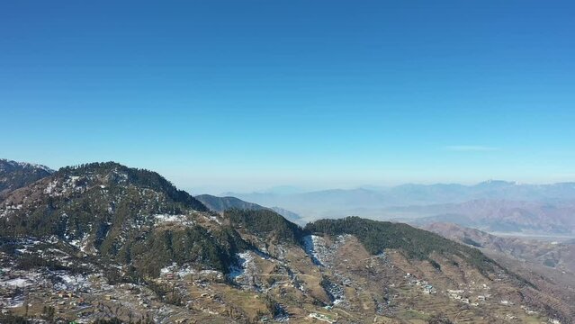 Aerial video over snowy mountains in northern area in Pakistan Swat