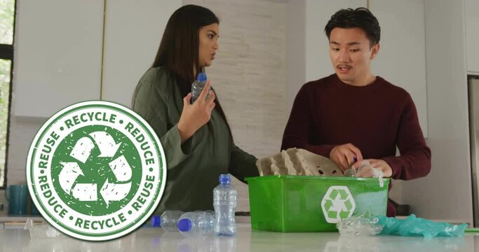 Animation of recycle sign over happy diverse couple recycling at home