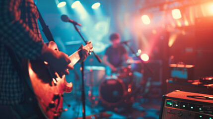 Live band concert with a guitarist in focus, set against a blurred stage backdrop for an atmospheric visual. Perfect for musicians and studio sessions - obrazy, fototapety, plakaty