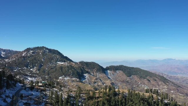 Aerial video over snowy mountains in northern area in Pakistan Swat
