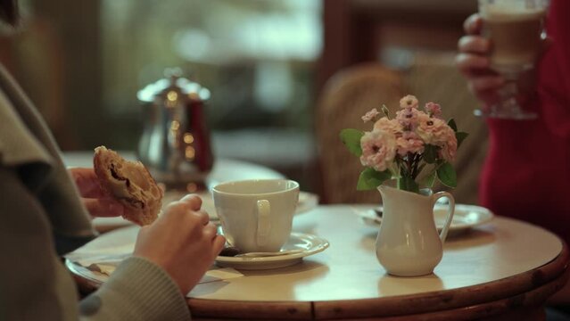 A typical morning in the charming streets of Paris. Croissant and coffee in a downtown old cafe.