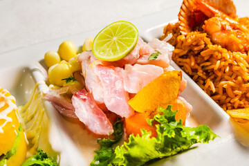 The close-up of ceviche, causa de papa, and seafood rice. Peruvian gastronomy. Marine trio