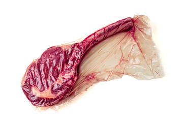 tomahawk steak in vacuum plastic bag, meat preservation. isolated white background
