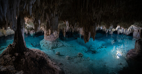 Underground caving and swimming in Sac Actun cave system in Tulum Mexico