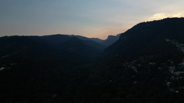 Aerial footage of the mountainside village at sunset in Indore, India