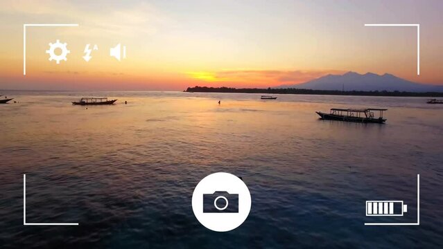 Animation of digital camera interface screen over boats on ocean at sunset