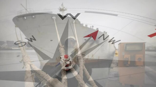 Animation of compass with arrow pointing to travel text over ship in harbour