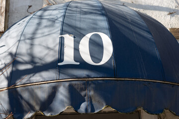 vintage quarter round awning with the number 10