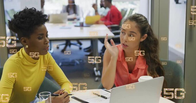 Animation of 5g over diverse colleagues discussing work in office