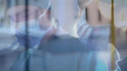 Animation of cars on street over diverse surgeons wearing face masks - Powered by Adobe