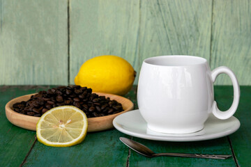 Hot black coffee lemon in white cup.