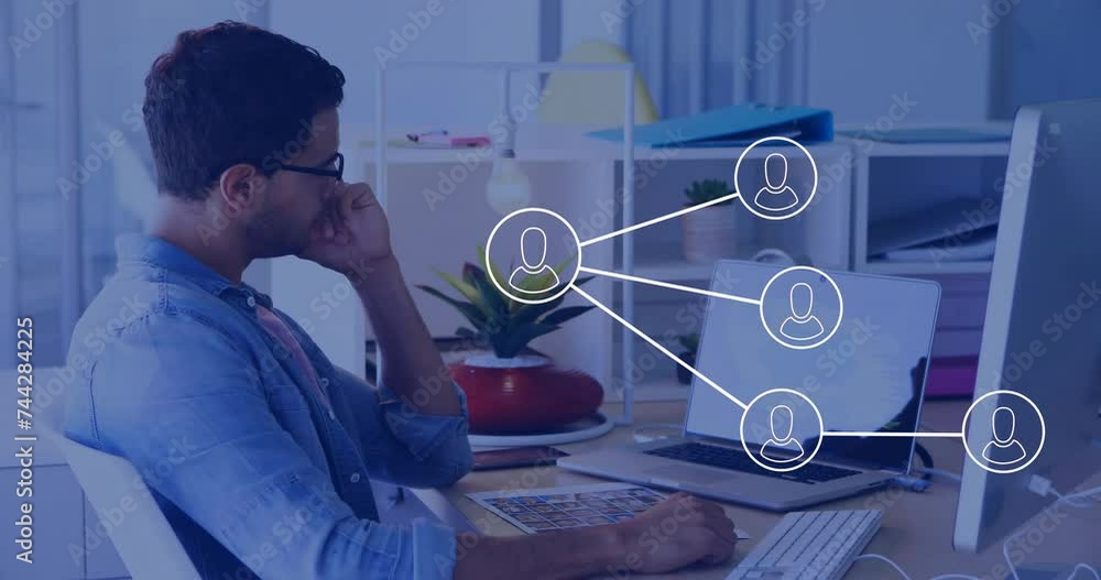 Poster animation of network of connections with icons over biracial businessman using computer