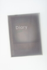 shadowy box with the word "diary" placed beneath tracing paper