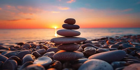 Foto auf Acrylglas Stack of stones on the beach at sunset or sunrise. Zen stones © marikova