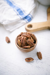 pecan nuts in wooden bowl