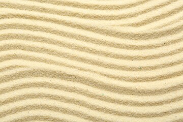 Zen rock garden. Wave pattern on beige sand, top view