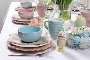 Festive table setting with painted eggs. Easter celebration