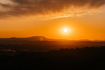Colorful sunset on top of Italian mountain alps. Beautiful mountain landscape. Morning sunrise time mountain scenery.