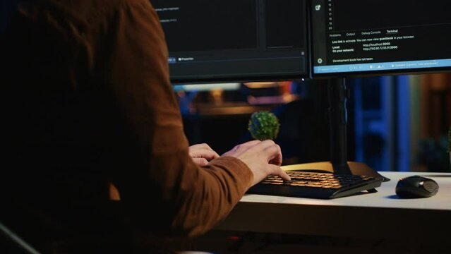 Angry programmer impatiently spamming broken keyboard buttons, trying to type lines of code in apartment office. Annoyed IT admin having difficulties with damaged computer peripheral, close up