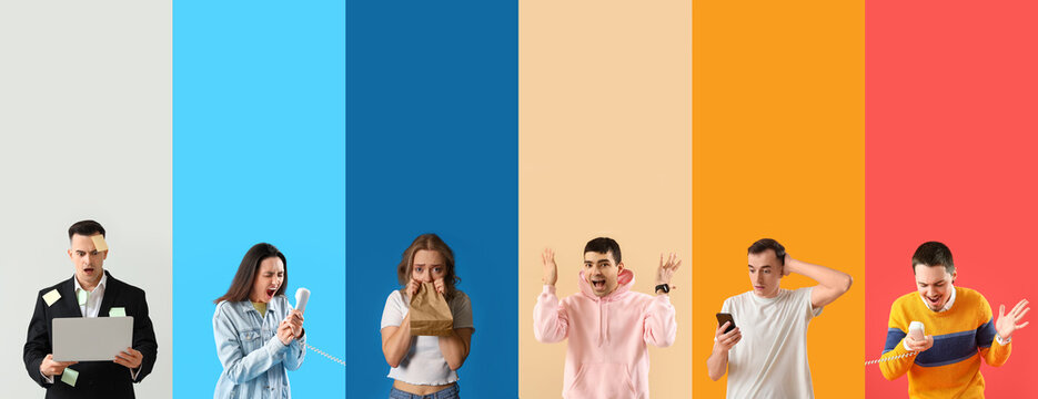 Stressed young man in hoodie and with watch on beige background - Powered by Adobe