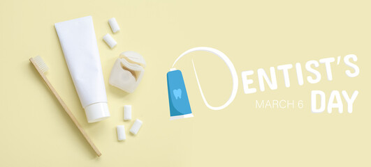 Toothpaste with brush, dental floss and chewing gums on light yellow background